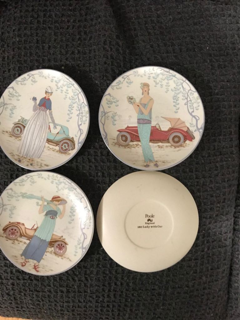 Poole pottery ‘lady with car’ set of scenic plates
