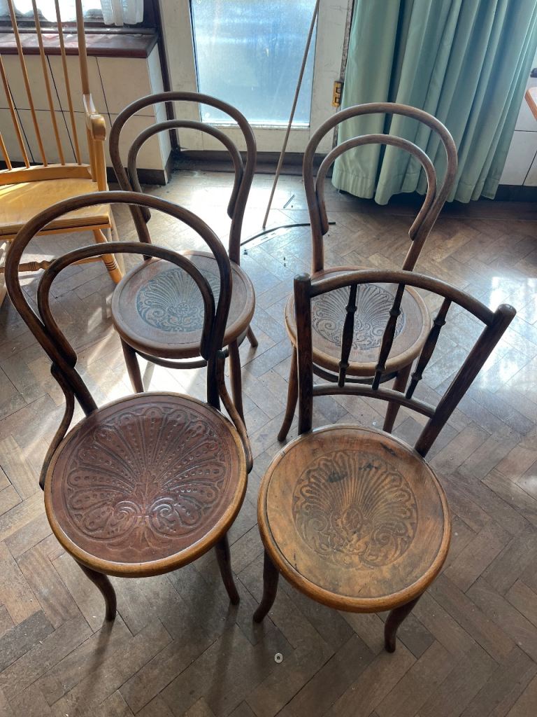 4 dark brown chairs