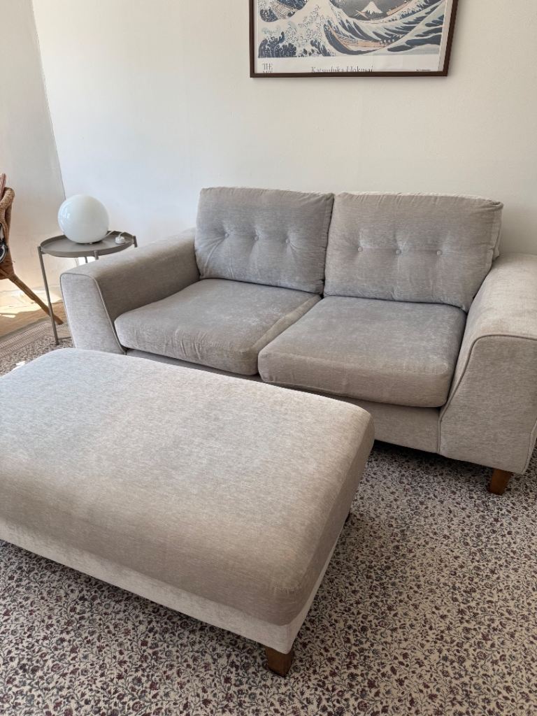 Grey Two-Seater Sofa with Matching Footstool – Good Condition