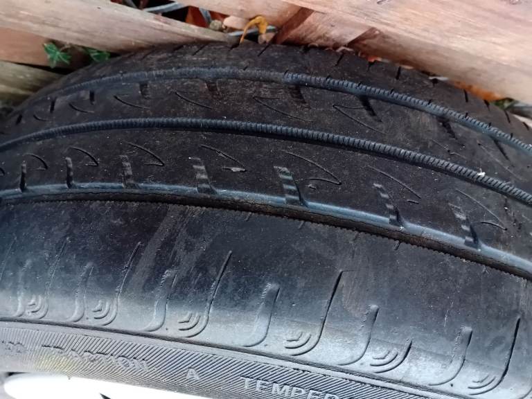 Metal wheels and tyres with genuine fiat wheel trims.