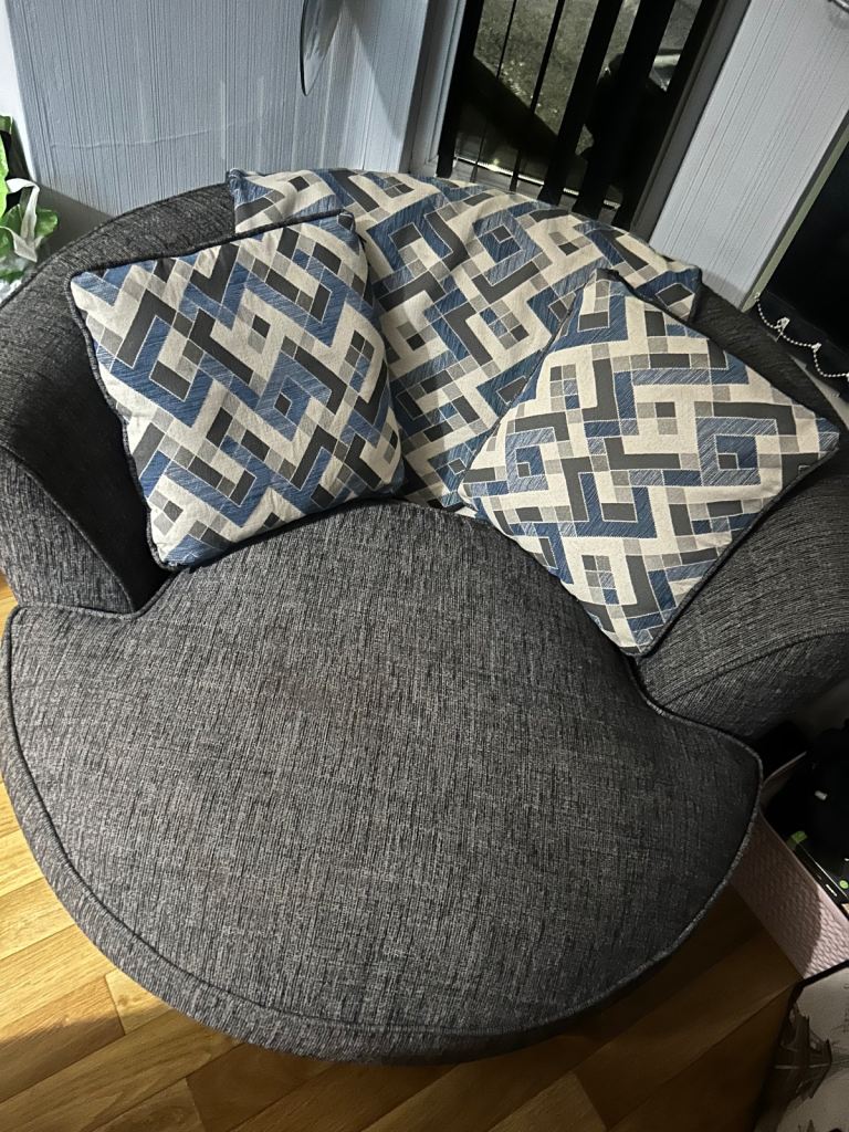 Swivel round cuddle chair 