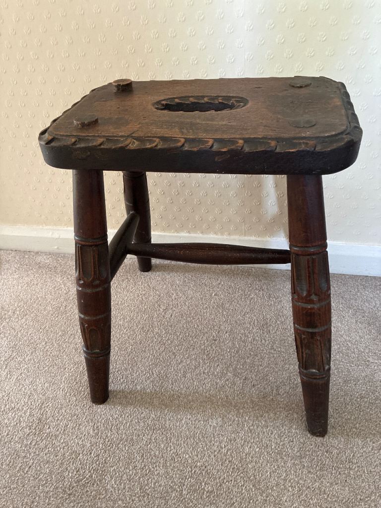 Rustic wooden milking stool