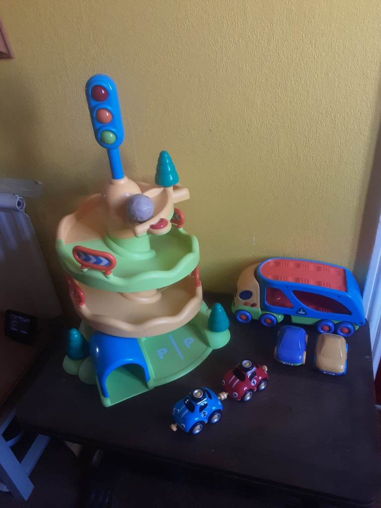 Early learning Centre  whizz down garage & car transporter + four cars 