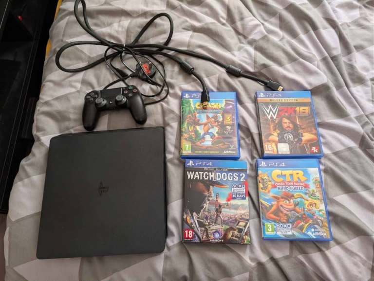 Sony PlayStation 4 Slim 500GB with controller and games (no box)