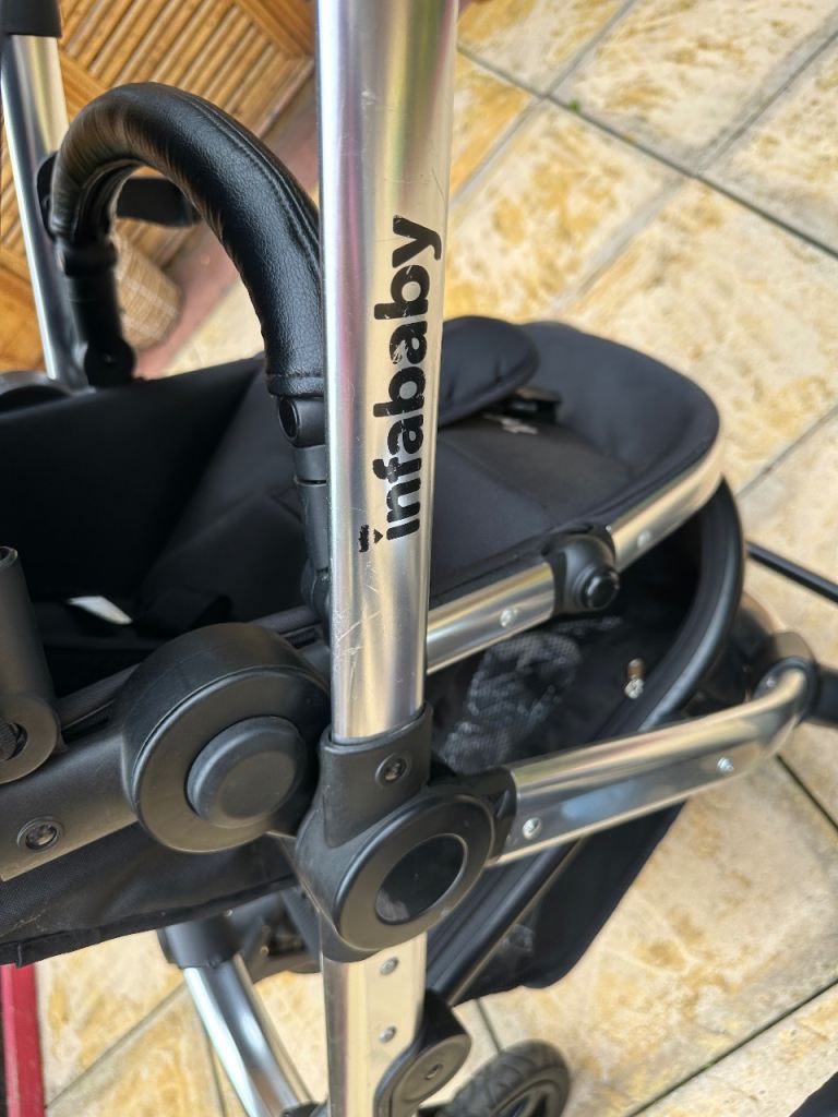 Black Infababy pushchair and car seat set and cover 