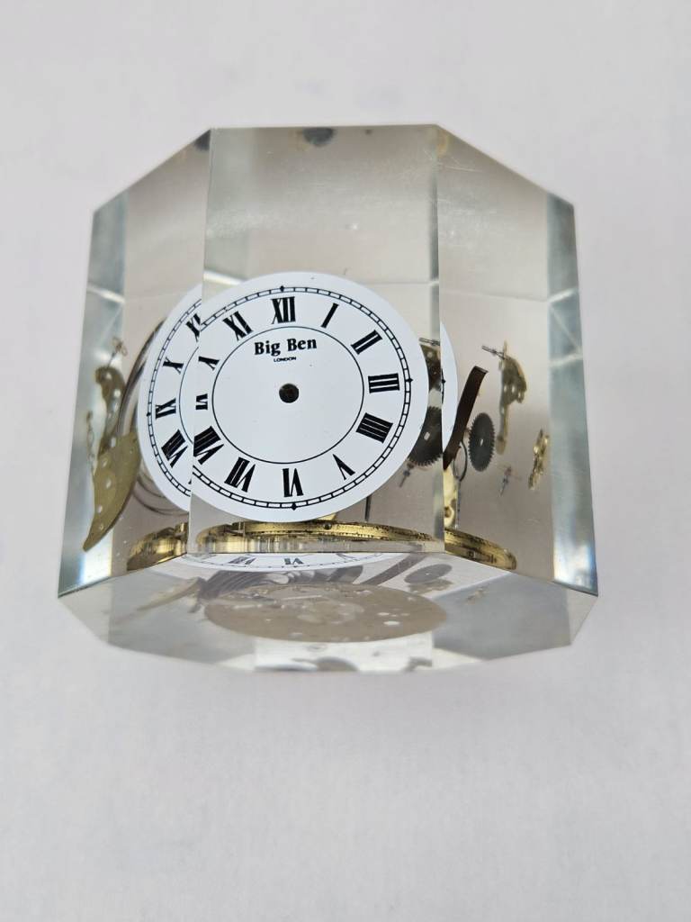 Retro, clear acrylic clock parts paperweight from the 1970's.