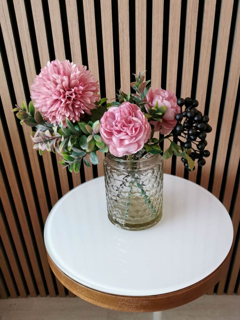Beautiful Flower Arrangement in Glass Vase. Artificial flowers. 