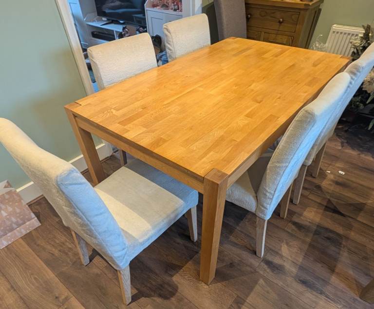 Solid oak dining table and chairs 