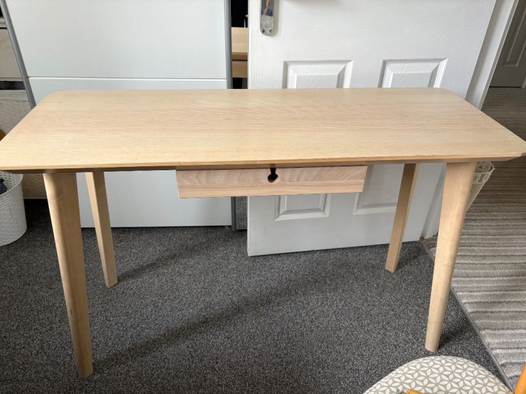 An ikea wooden desk/ dressing table.