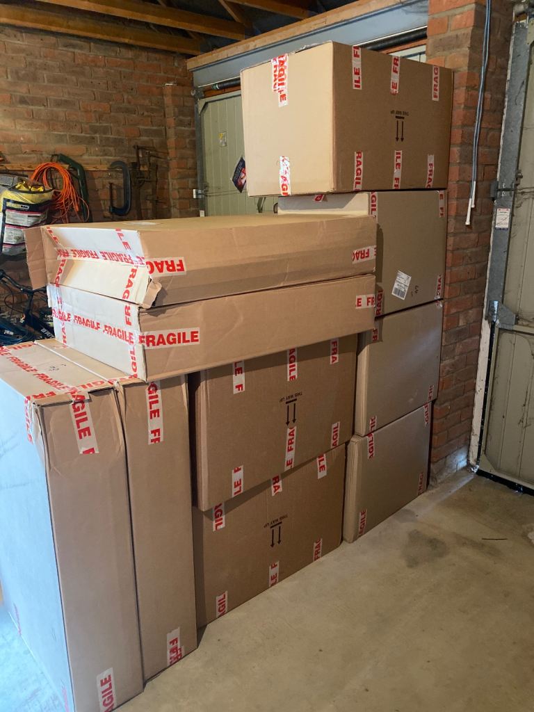 Packing boxes, paper and bubble wrap