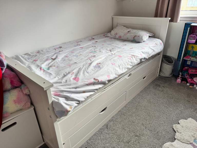 Kids trundle bed with drawers  