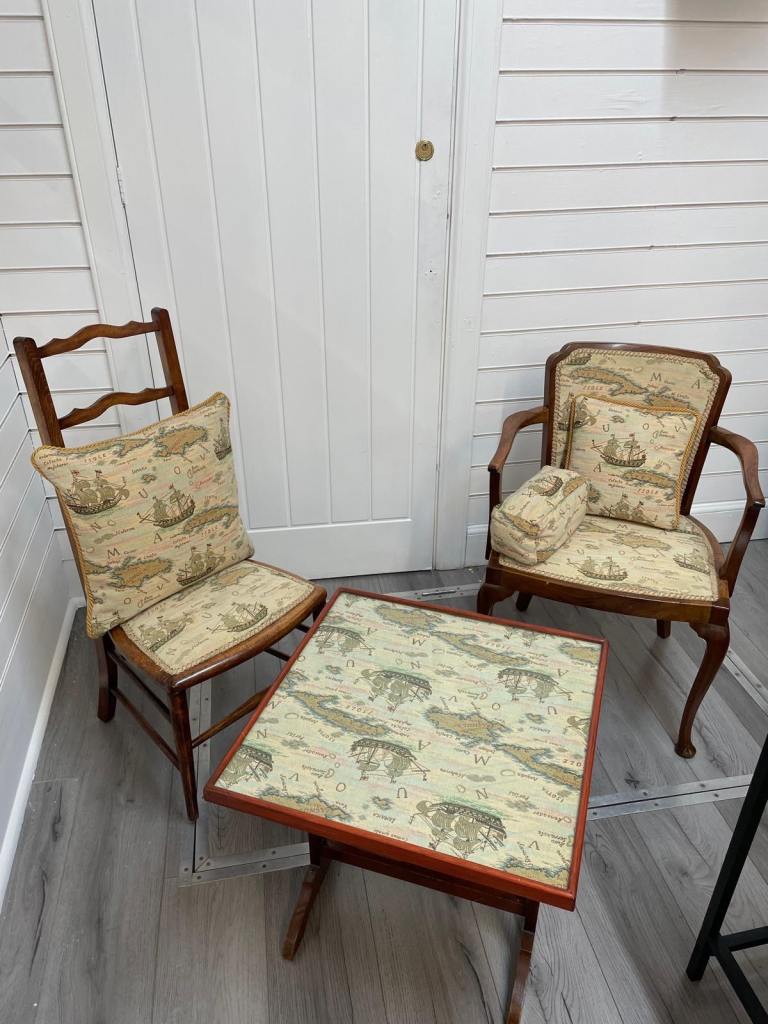 Two chairs and folding table upholstered 