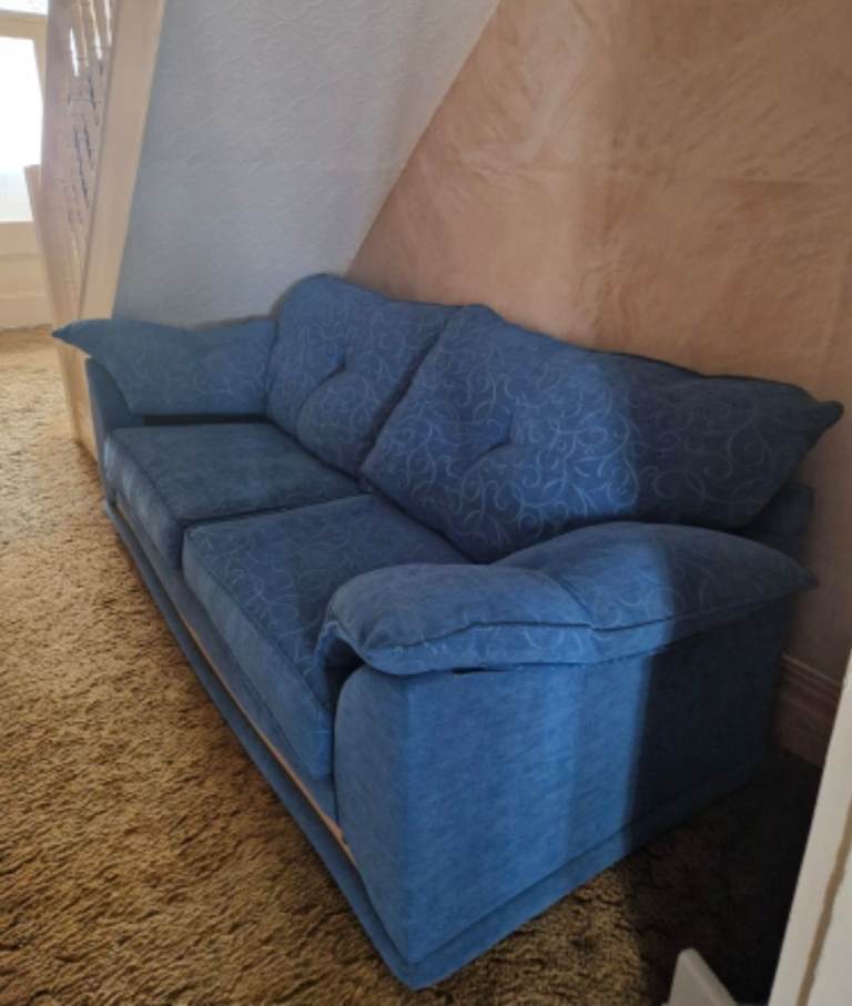 Two blue sofa's