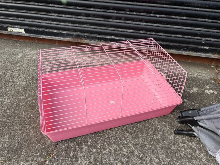 Pink guinea pig pet cage with plastic base