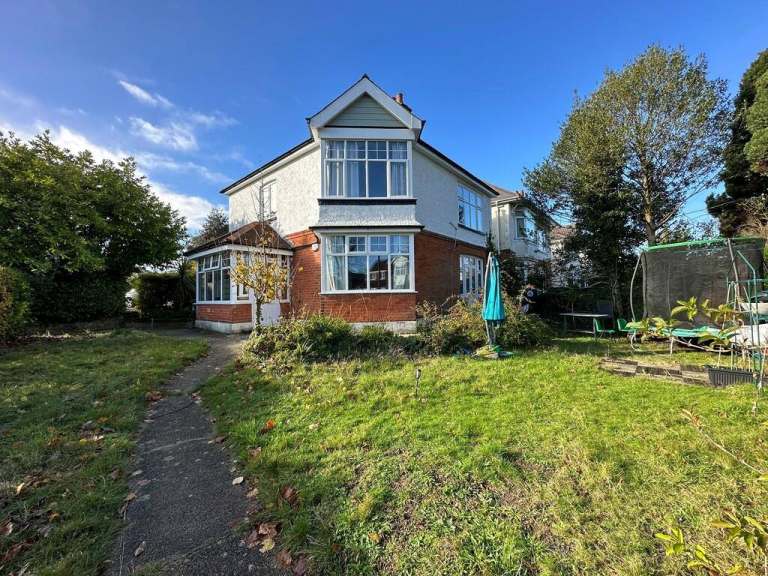 Ground-floor two-bedroom flat with a private rear garden and shared use of the front garden