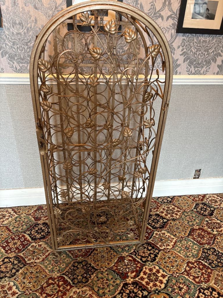 Lovely Gold Metal Wine Rack with Decorative Leaf Detailing