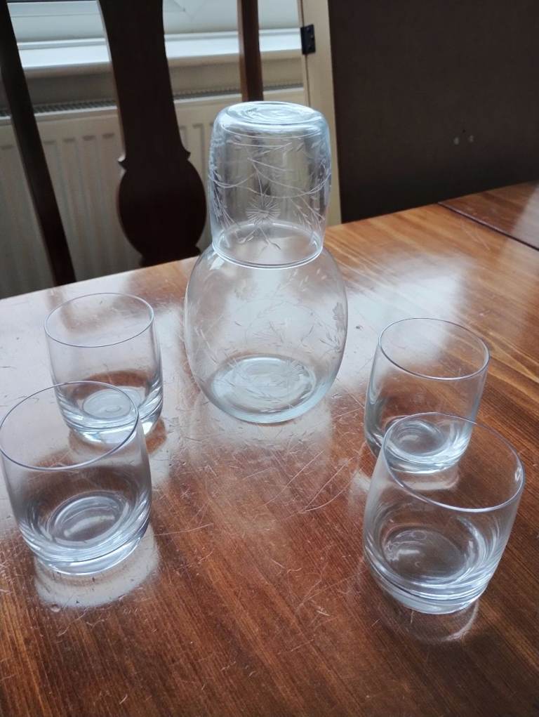 Water bottle and four water glasses 