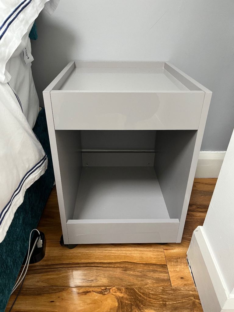Grey bedside table with wheels 
