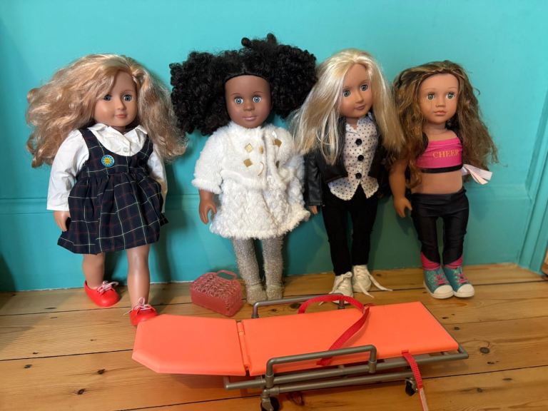 4 x Our Generation dolls with outfits and accessories 