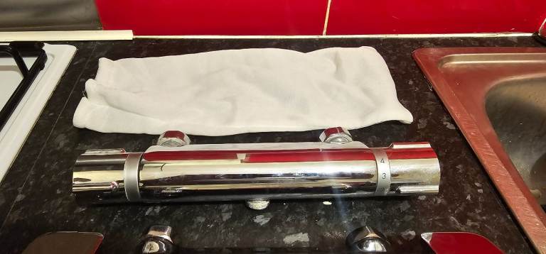 2 chrome shower bars