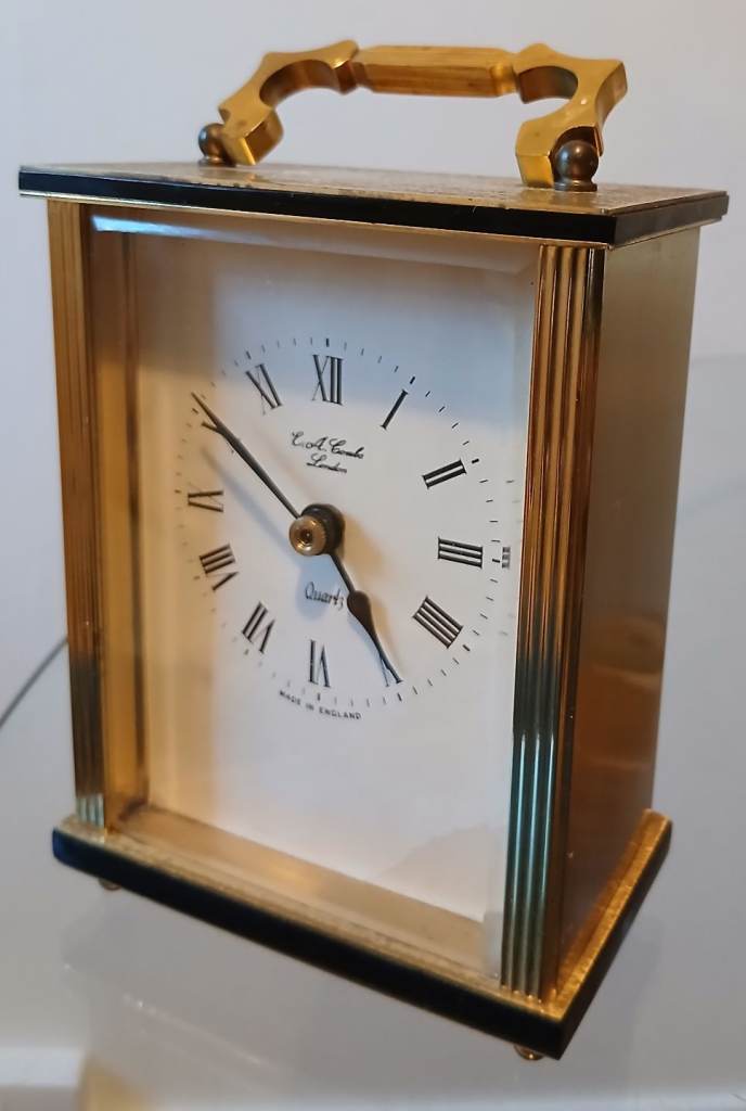 A 1960s vintage mantel carriage brass clock