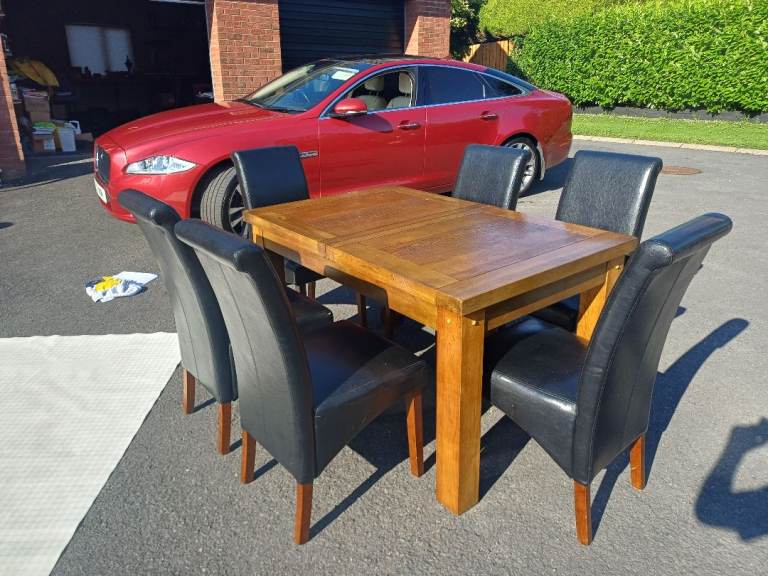 Solid Wood Extending Dining Table with 6 Black Faux Leather Chairs