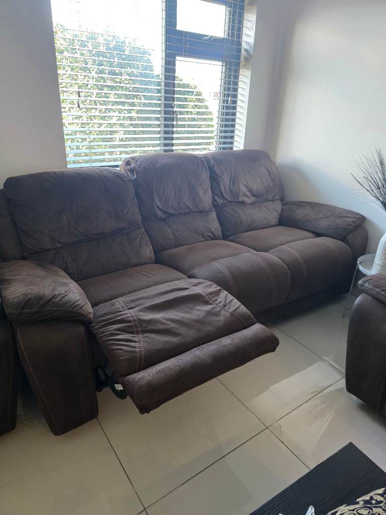 2x Brown Sofas 3 seater with manual recline feature good condition 