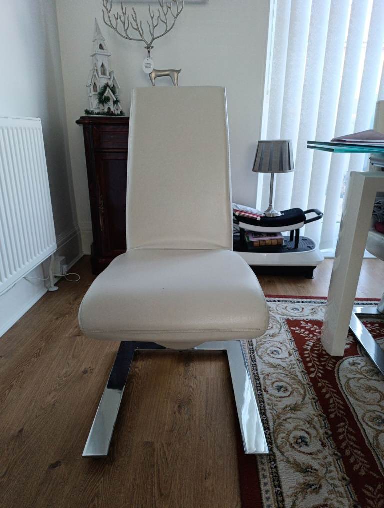 4 Cream coloured faux leather dining chairs