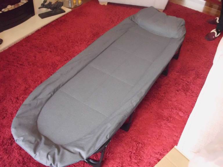 Fold up single guest bed.