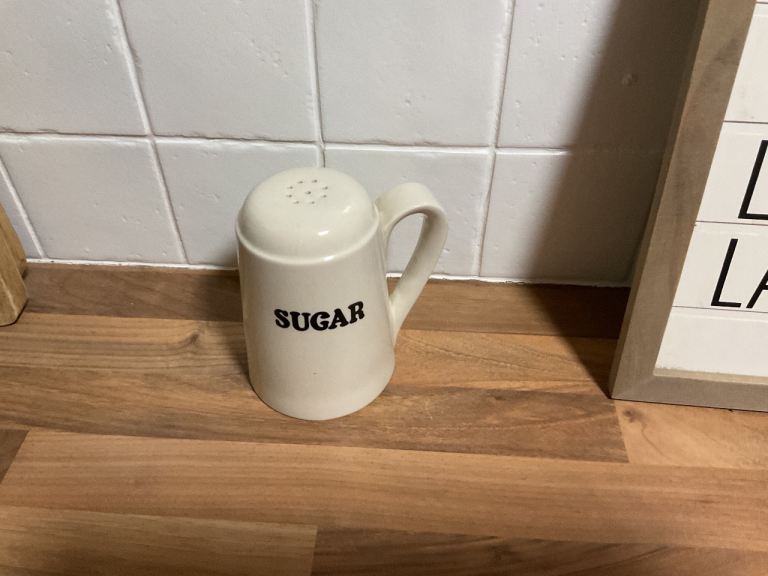 Vintage white sugar pourer