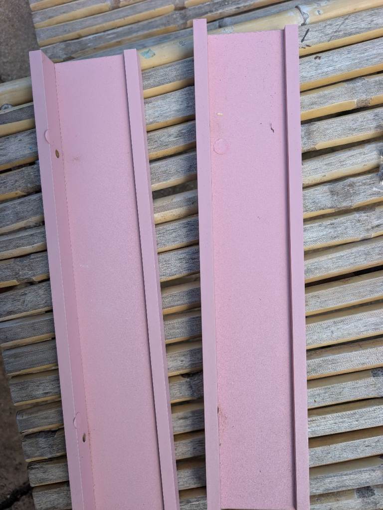 Two IKEA pink shelves 