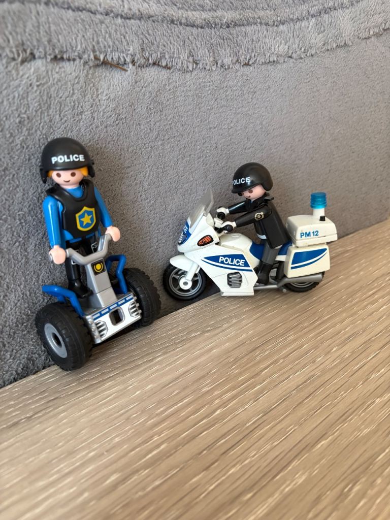 Playmobile Police figures on motorcycles and balance rider.