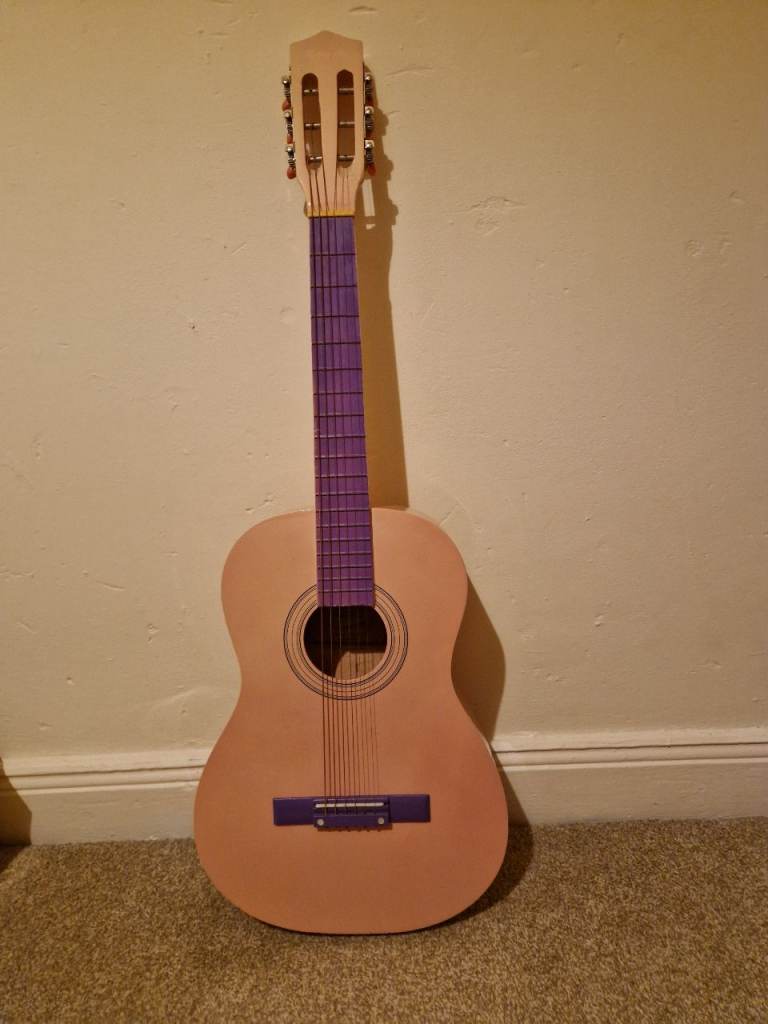 Pink toy guitar 