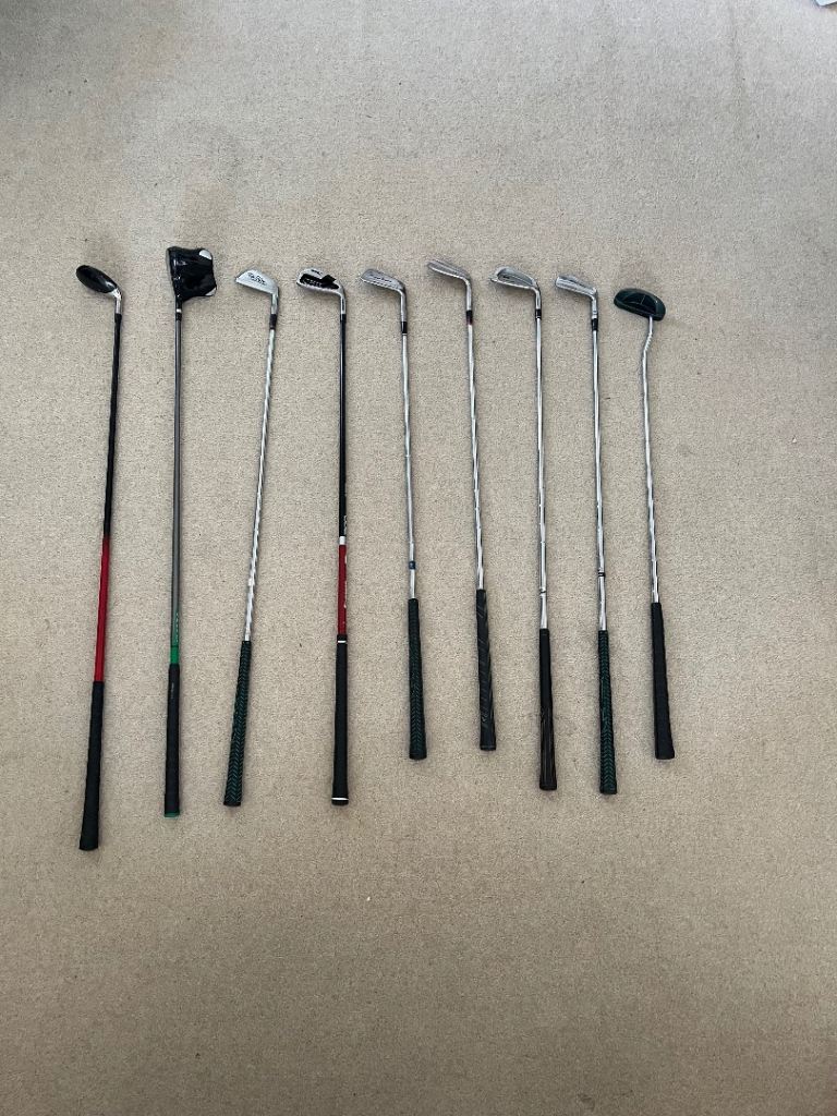 Golf clubs irons 5 wood and a 22 degree 