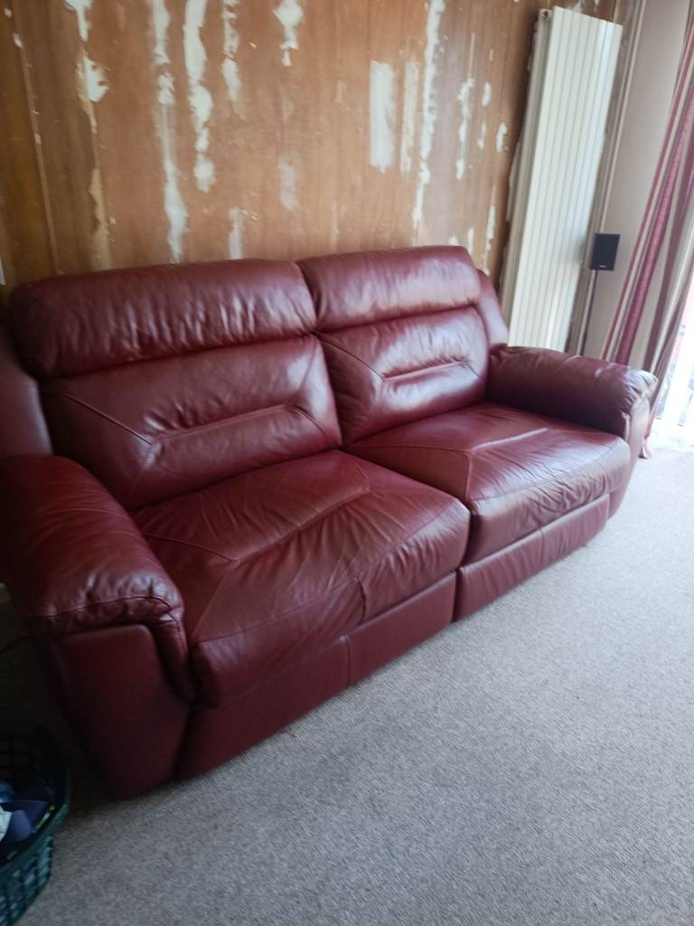 2 leather sofas in red one 2 seater and 1 3 seater they are FREE 