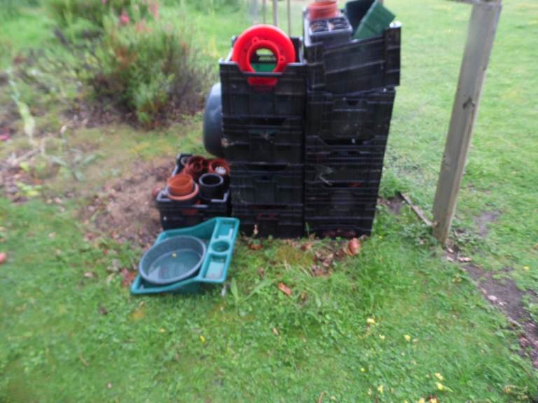 job lot of garden pots and trays and crates and hot bins and wheel barrow