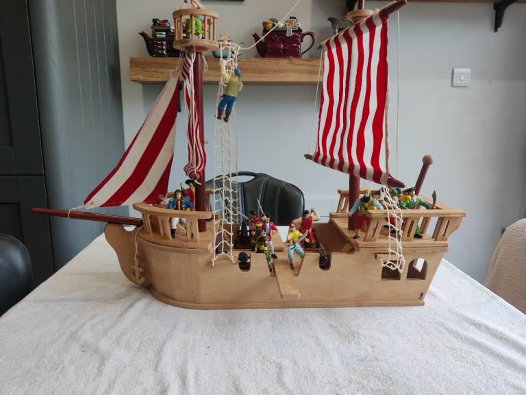 Wooden pirate ship and pirates