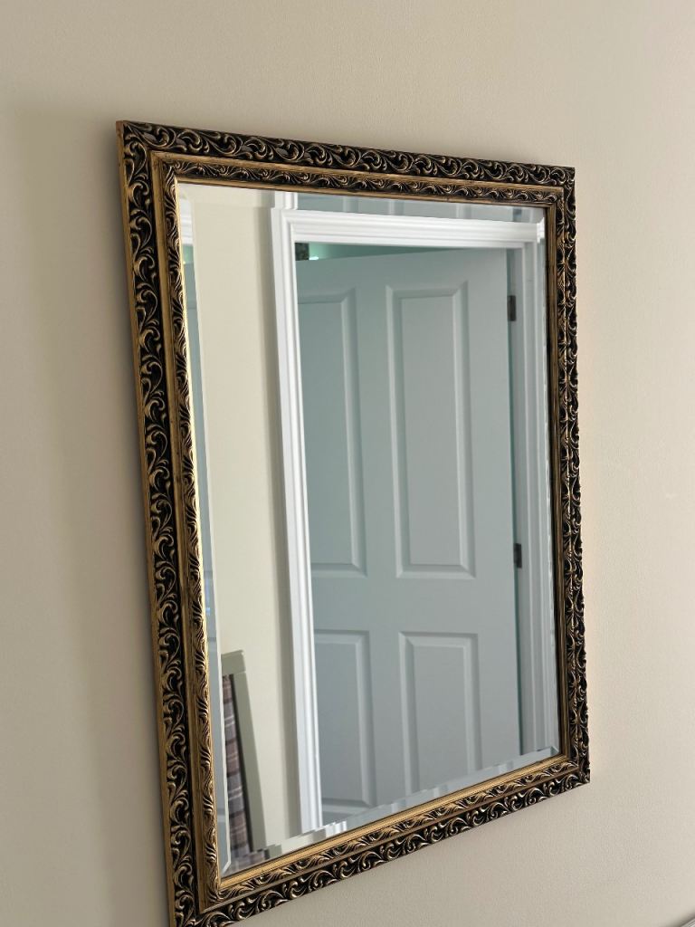 Gold rimmed antique style mirror. 26cm / 20cm