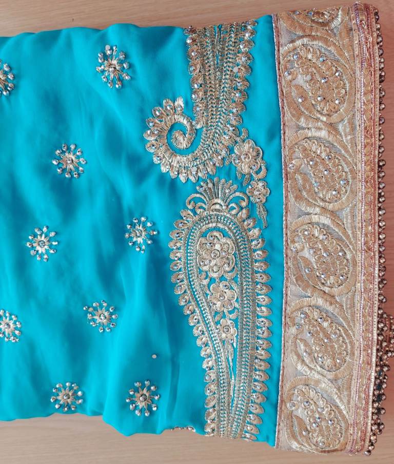 Turquoise saree with blouse piece