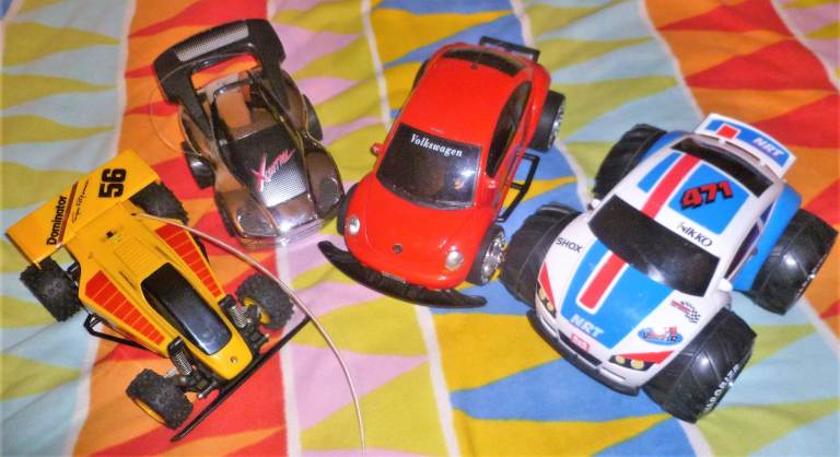 4 Radio Control Cars/ Dominator, Silverlt X-Control, New Bright VW Beetle & Nikko Vaporizr 