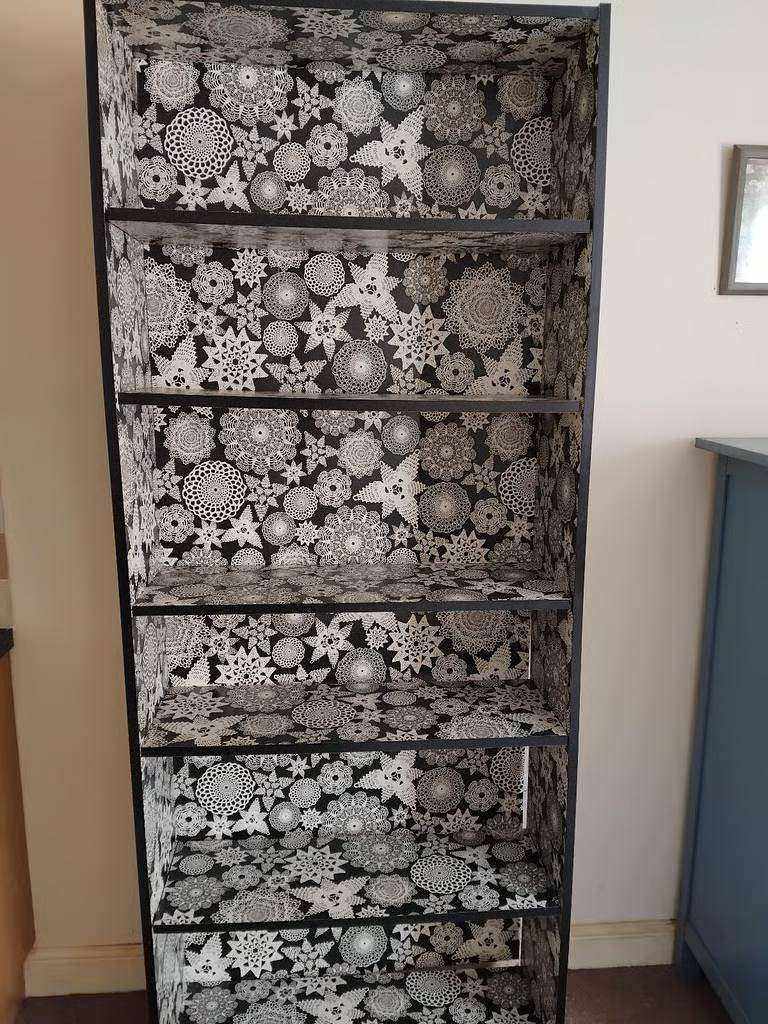 A Very Tall Attractive Black and White Mandalas Pattern Bookcase With 6 Shelf Spaces