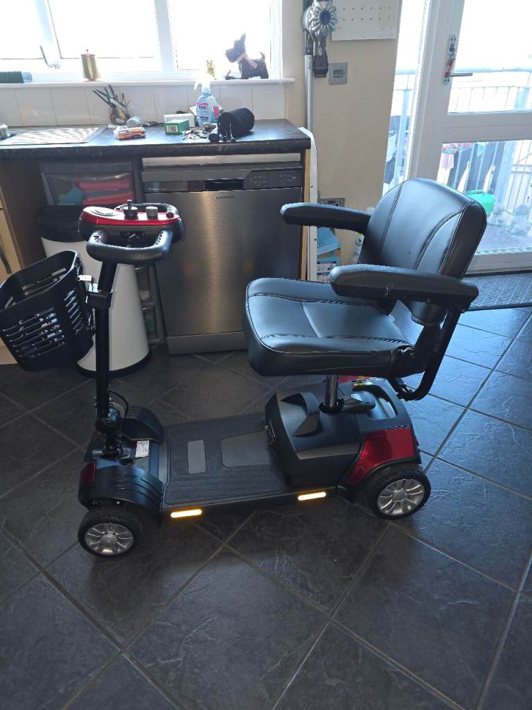 Red electric mobility scooter 