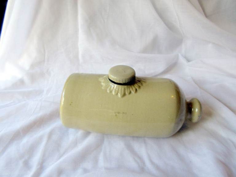 AN ANTIQUE STONEWARE HOT WATER BOTTLE, STONE PIG
