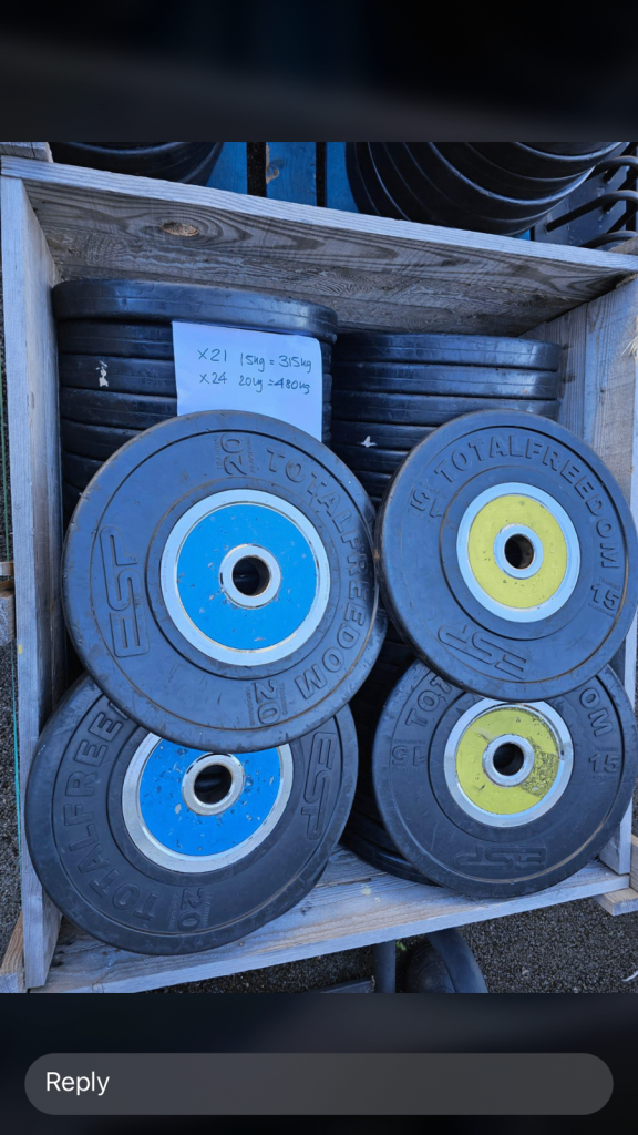 Technogym Bumper Competition Colour coded weight plates with Sandwich racks