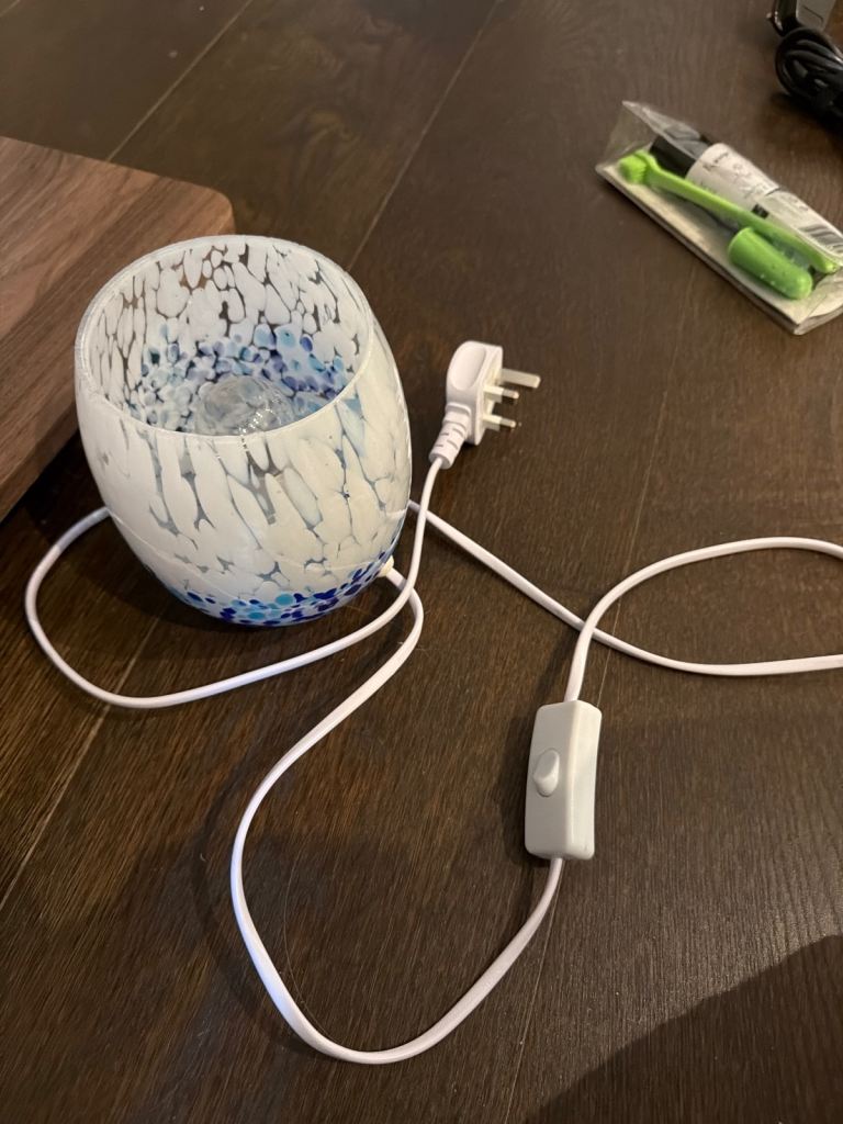 Electric glass wax melt burner / oil burner in a blue and white pattern.