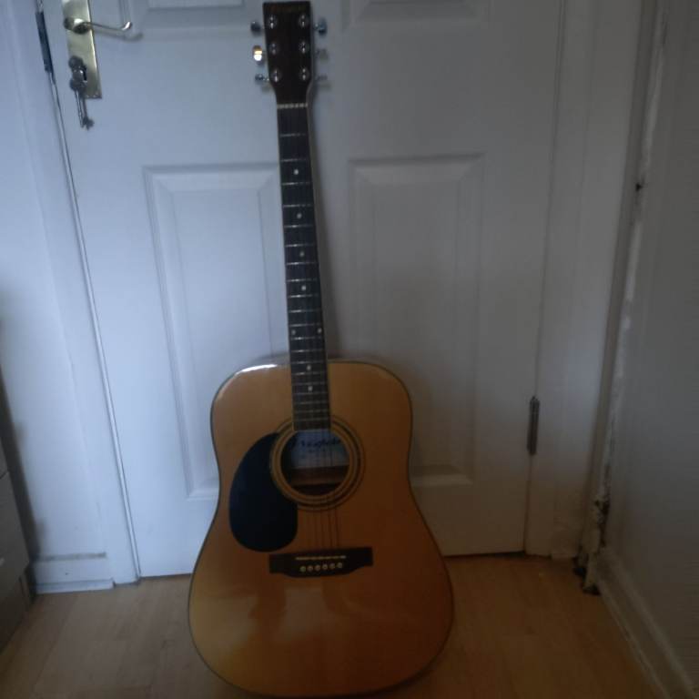 Left handed acoustic guitar and case for sale 