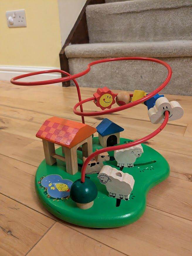 Wooden bead maze with farm animals