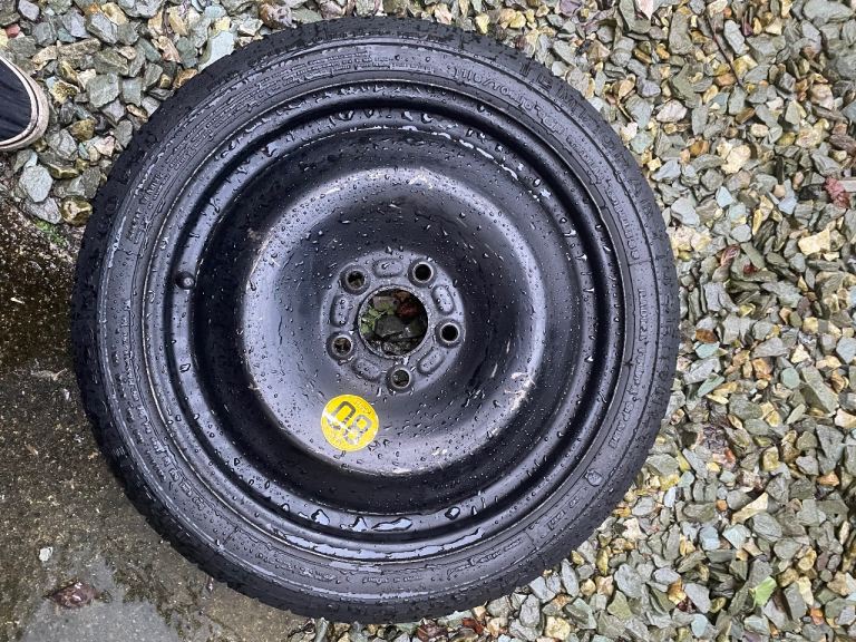 Ford 5 stud small 16” space saver wheel. 