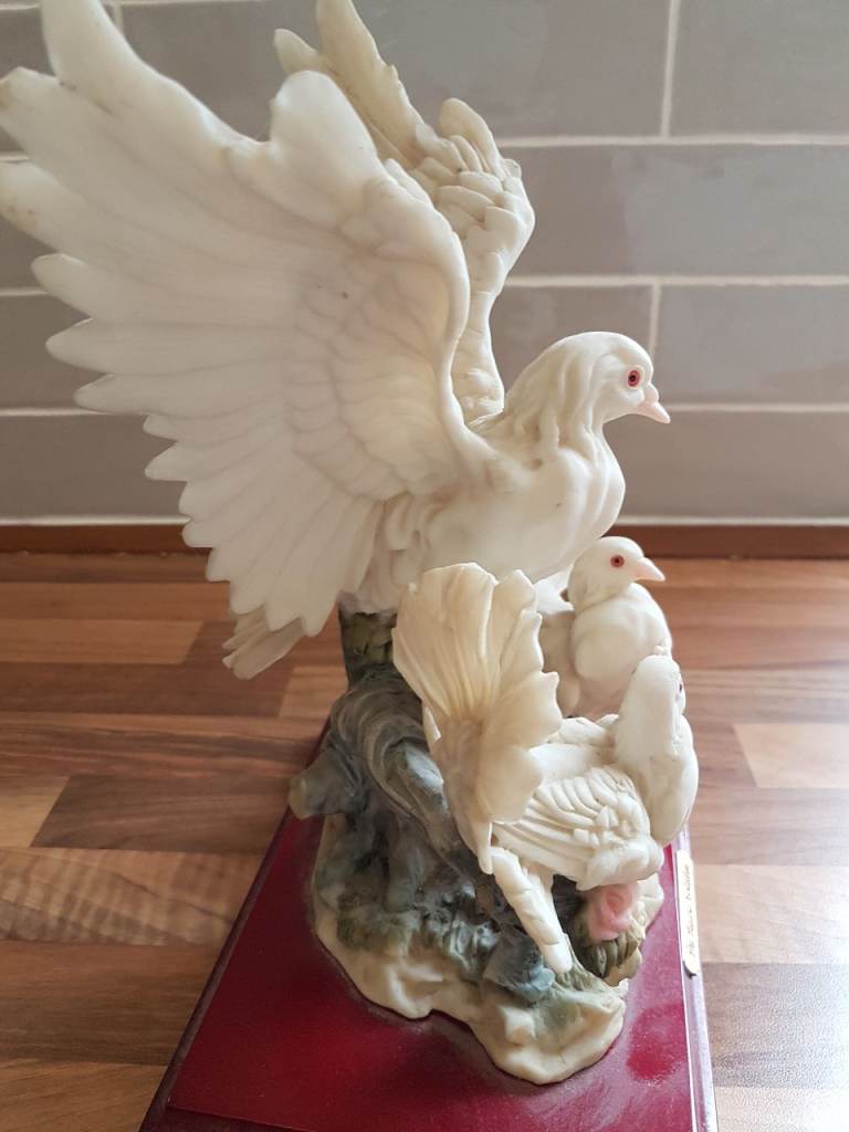 A fairly Large and lovely Display of Three Doves on a Woodern Base.
