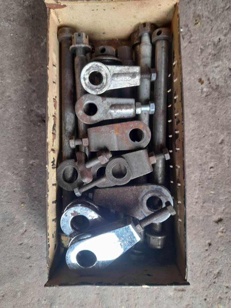 Box of wheel spindles + some chain adjusters 